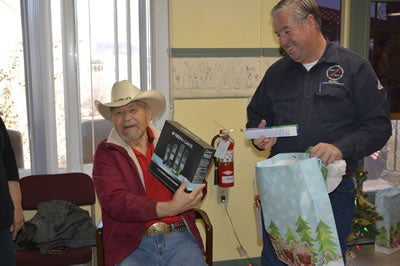 CDEC employee distributing gifts