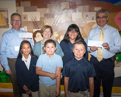 Robert E. Castillo with students from St. Joseph Mission School in San Fidel, N.M.