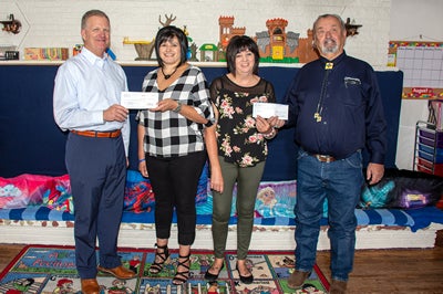 Check presentation at Casa San Jose Child Care and Behavioral Health Center in Milan, N.M.